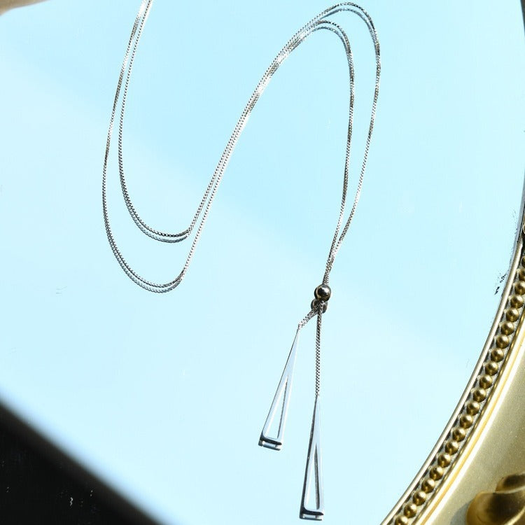 Sleek Triangle Tassel Necklace – Platinum Plated Stainless Steel